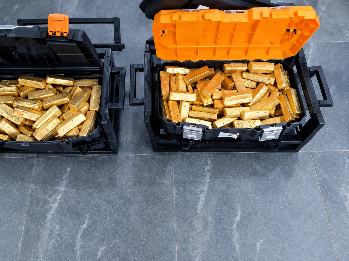 Gold-coloured processed mineral material arranged in secure cases